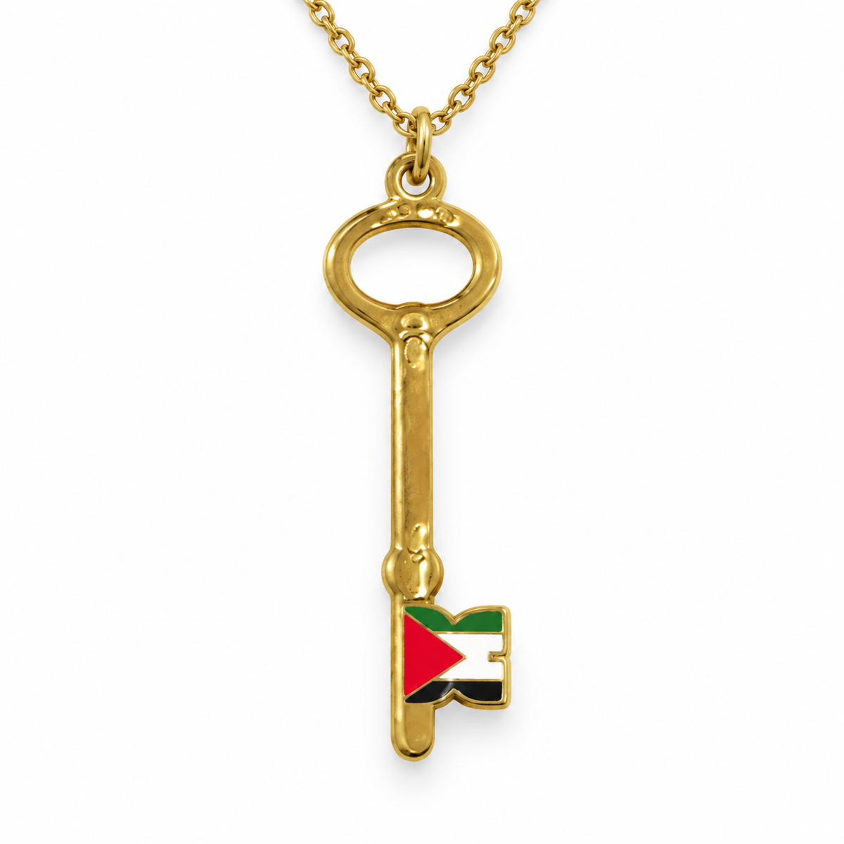 Gold-tone key pendant necklace with a red, green, white and black flag detail on a white background.