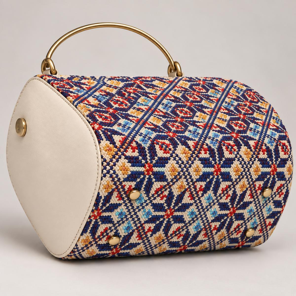 Cream Geometric Barrel-Shaped Handbag — detail of the visible front design.