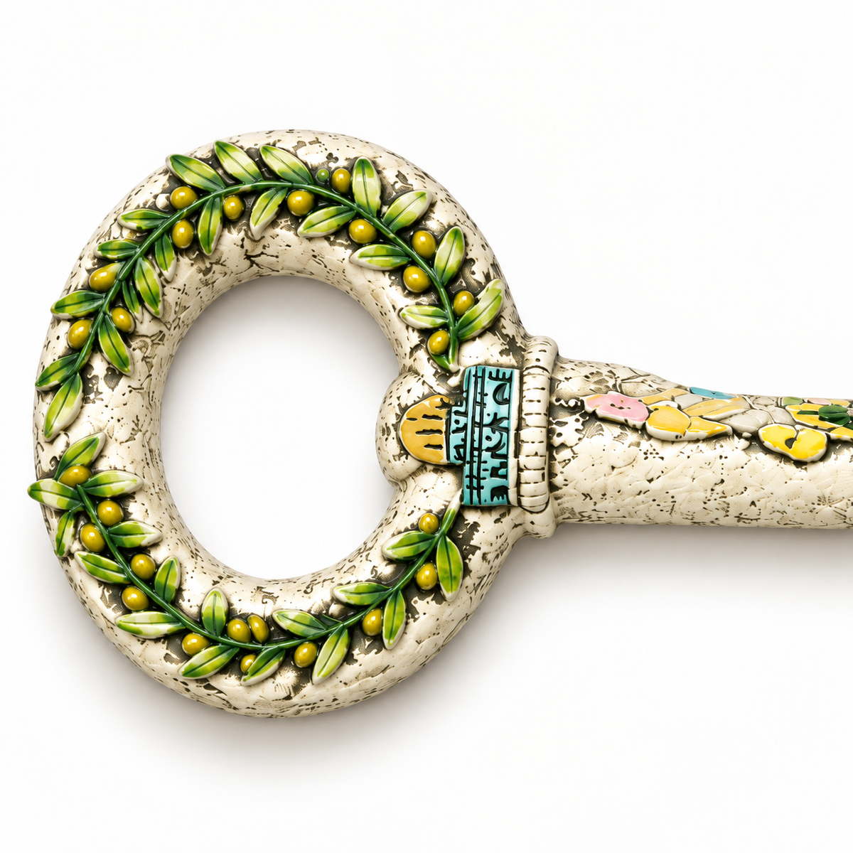 Detail of the green olive leaves and small dome motif on the decorative key.